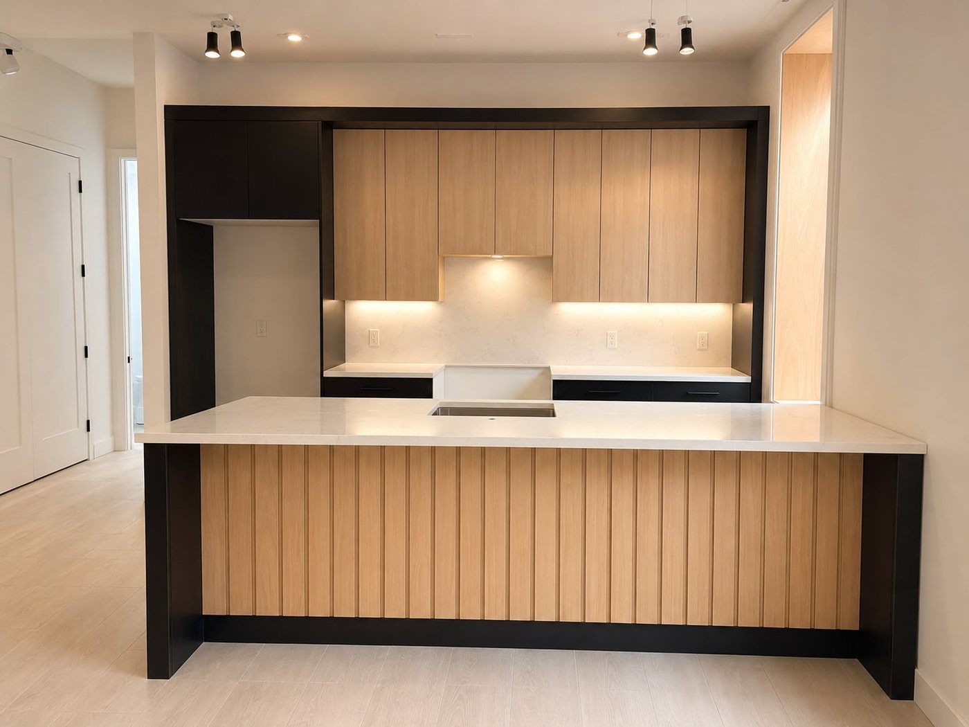 Wood-grain slab cabinets with black frame and slatted island